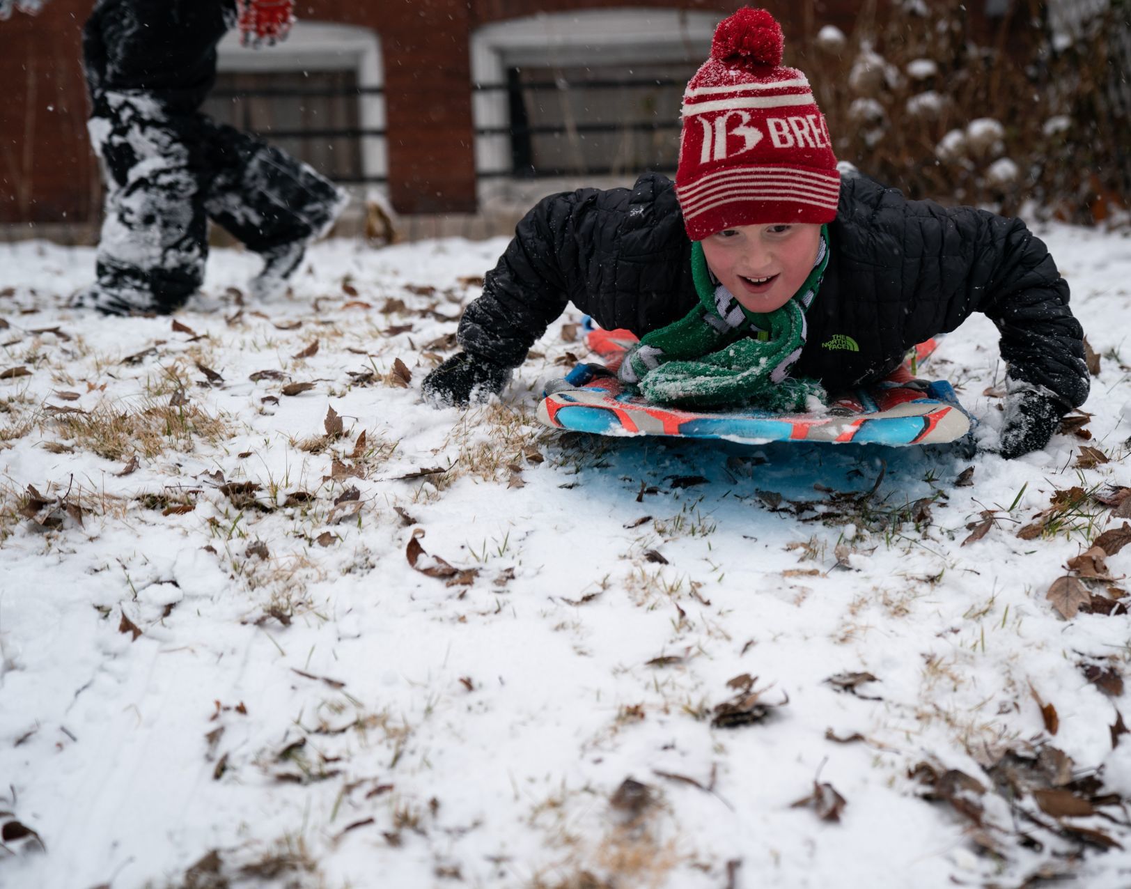 Some sledding action on a snowy Sunday